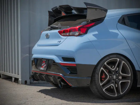 Light blue Hyundai Veloster N with large spoiler and Takeda Cat-Back Exhaust system