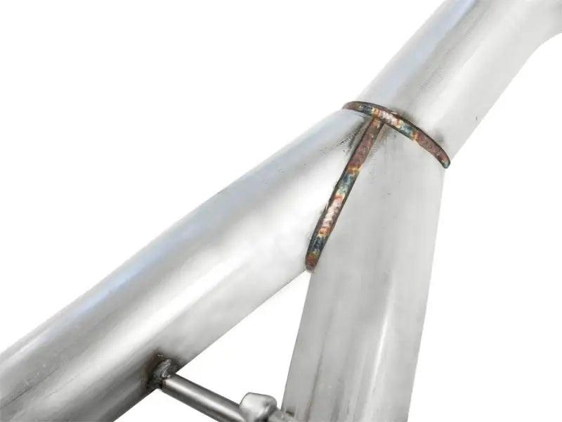 Welded metal pipe junction on aFe MachForce XP cat-back with polished dual tips