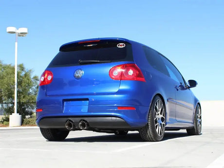 Blue Volkswagen hatchback with afe machforce XP cat-back exhaust and polished dual tips