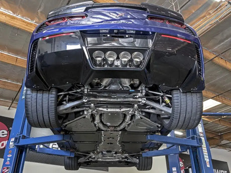 Blue Corvette on lift with afe machforce xp axle back exhaust and carbon fiber tips