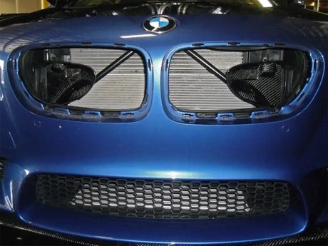 Blue BMW F10 M5 front end with exposed radiator showcasing afe magnum force intake system