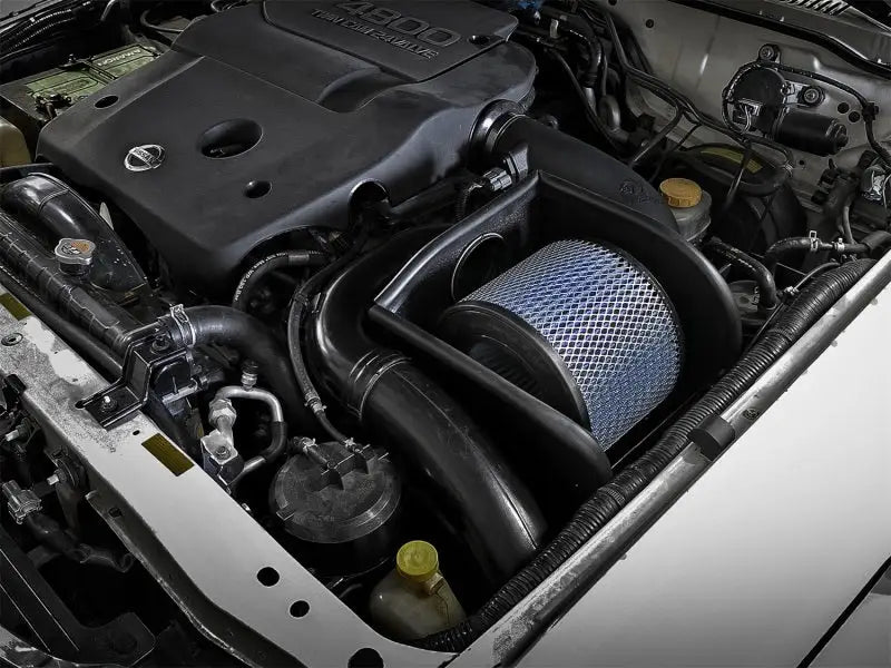 Automobile engine compartment with aFe Magnum Force Stage-2 Pro 5R Cold Air Intake for Nissan Patrol