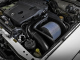 Automobile engine compartment with aFe Magnum Force Stage-2 Pro 5R Cold Air Intake for Nissan Patrol