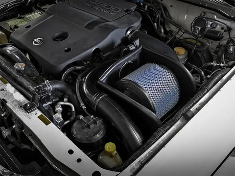 Automobile engine compartment with aFe Magnum Force Stage-2 Pro 5R Cold Air Intake for Nissan Patrol