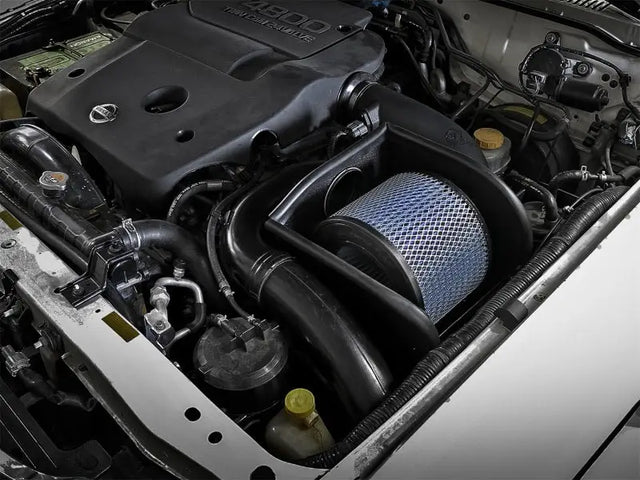 Automobile engine compartment with aFe Magnum Force Stage-2 Pro 5R Cold Air Intake for Nissan Patrol