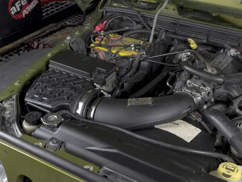 Car engine compartment with aFe Momentum GT Stage 2 Pro 5R Intake System for Jeep Wrangler
