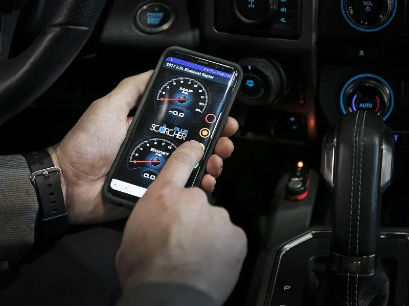 Smartphone showing vehicle performance with afe scorcher blue on ford explorer V6 3.0L
