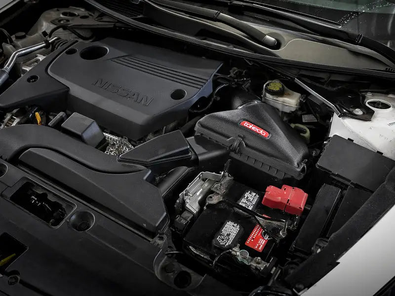 Car engine compartment with aFe Takeda Stage-2 Pro Dry Cold Air Intake System