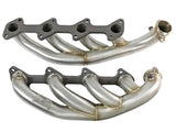 Two stainless steel exhaust manifolds for aFe Twisted Steel Headers on Ford V8 diesel trucks