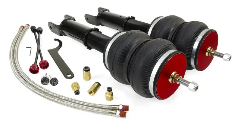 Air Lift Performance 2014+ Infiniti Q50 RWD/AWD Rear Kit featuring double-bellow air springs, monotube shocks, and various installation components.