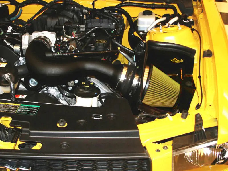 Yellow car engine compartment.