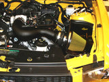 Yellow car engine compartment.