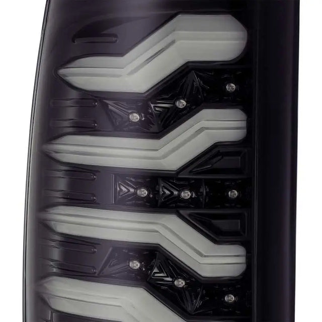 AlphaRex 09-18 Dodge Ram 1500 PRO-Series LED Tail Lights Jet Black close-up detail.