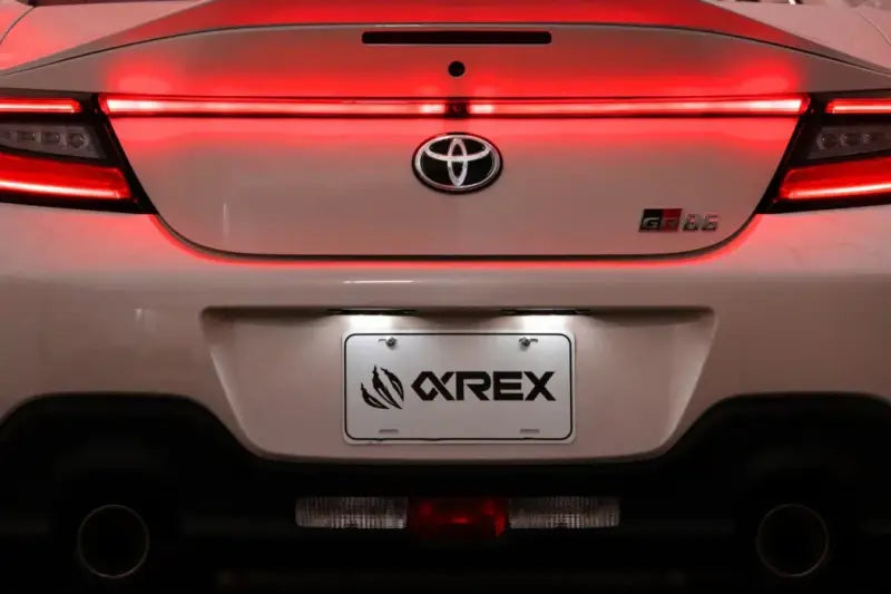 White Toyota GR86 rear view with AlphaRex LUXX LED Vivid Red trunk light