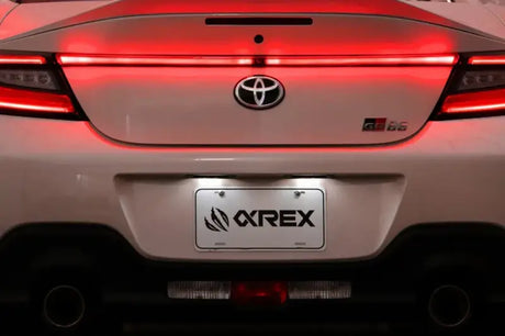 White Toyota GR86 rear view with AlphaRex LUXX LED Vivid Red trunk light