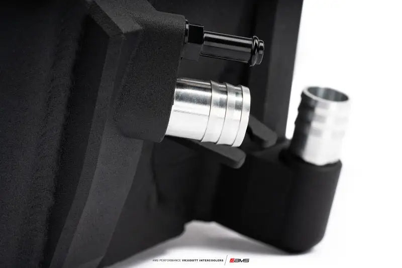 Black metal reservoir with silver hose fittings for AMS Performance Nissan Z VR30 intercoolers