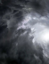 Ominous storm clouds behind Answer 23 Aerlite Glove midnight blue white youth small