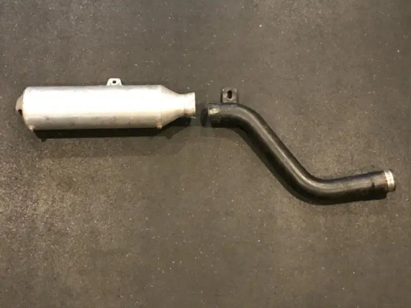 Motorcycle exhaust system with red, white, and blue finish for high performance