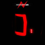 Illuminated red LED taillight assembly for Nissan Titan with black housing and smoke lens