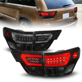 Smoked LED tail lights for Jeep Grand Cherokee with black housing and lightbar
