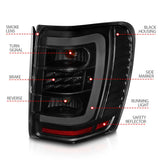 ANZO 1999-2004 Jeep Grand Cherokee LED Tail Lights w/ Light Bar Black Housing Smoke Lens - Truck & Automotive