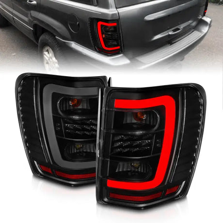 ANZO 1999-2004 Jeep Grand Cherokee LED Tail Lights w/ Light Bar Black Housing Smoke Lens - Truck & Automotive