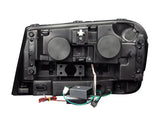 Rear view of Chevrolet Trailblazer projector headlight set with wiring and electronics