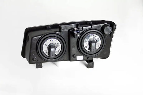 Rear view of Chevrolet Silverado crystal headlights black with two bulb sockets installed