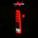 Illuminated Nissan Frontier LED taillights with black housing and clear lens