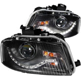 Black aftermarket Audi A3 projector headlights with LED style daytime running lights