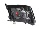 Black automotive headlight assembly for Dodge Ram with projector headlights and halo chrome finish