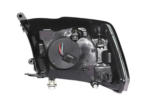Black automotive headlight assembly for Dodge Ram with projector headlights and halo chrome finish