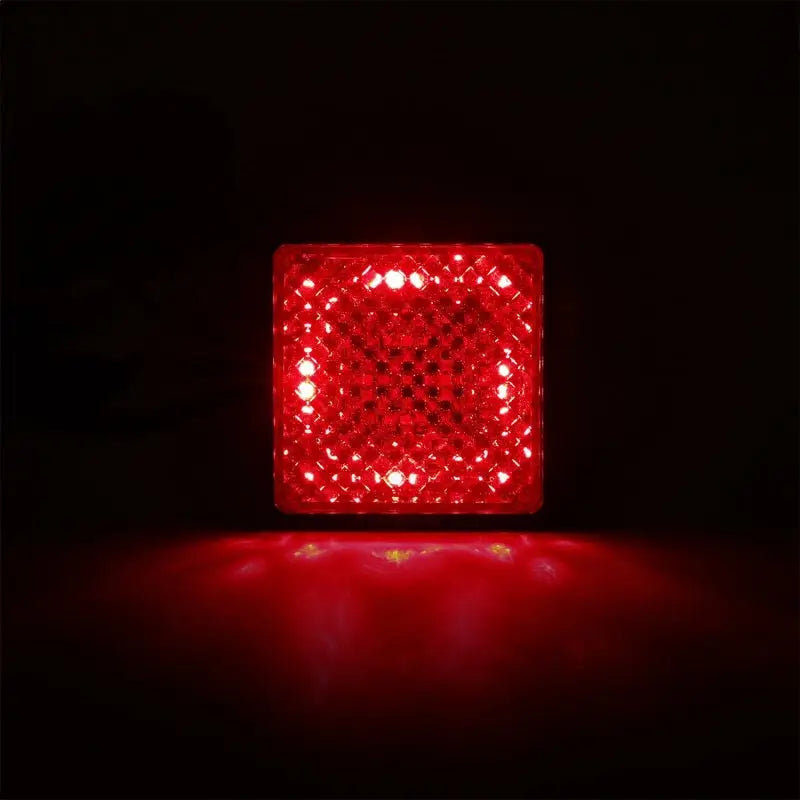 Red reflective cube on ANZO Universal LED Hitch Light with clear lens and black housing