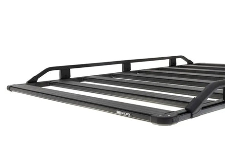 Black metal roof rack on ARB Base Rack Guard Rail Suits 1770020 for tough outdoor use