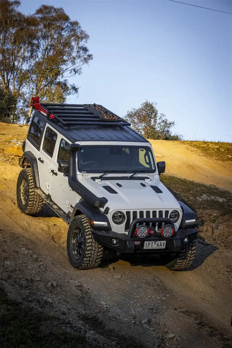 White Jeep Wrangler with ARB Base Rack Mount Kit showing a base rack specific install