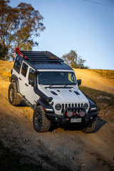 White Jeep Wrangler with roof rack showing ARB Base Rack Mount Kit for base rack specific setup