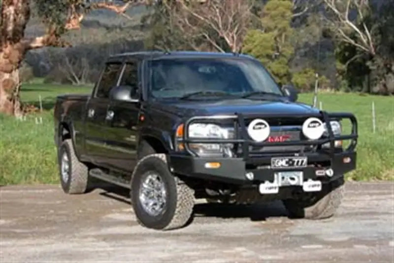 Black ARB Combar GMC Classic pickup truck with bull bar for tough looks