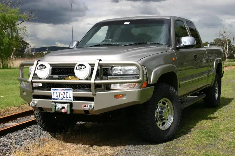Silver pickup truck with arb combar slvrado99-02 bull bar for tough off-road look