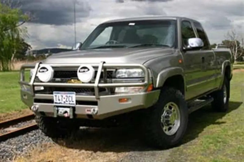Silver pickup truck with ARB Combar Slvrado99-02 bull bar for rugged look