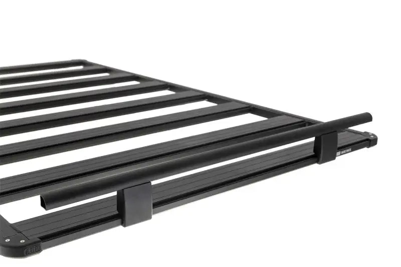 Black metal roof rack with ARB Guard Rail for added vehicle protection