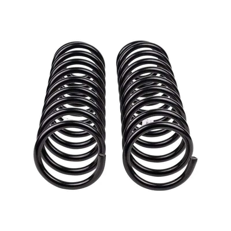 Two black OME coil springs for Jeep Jk front heavy-duty coil spring replacement
