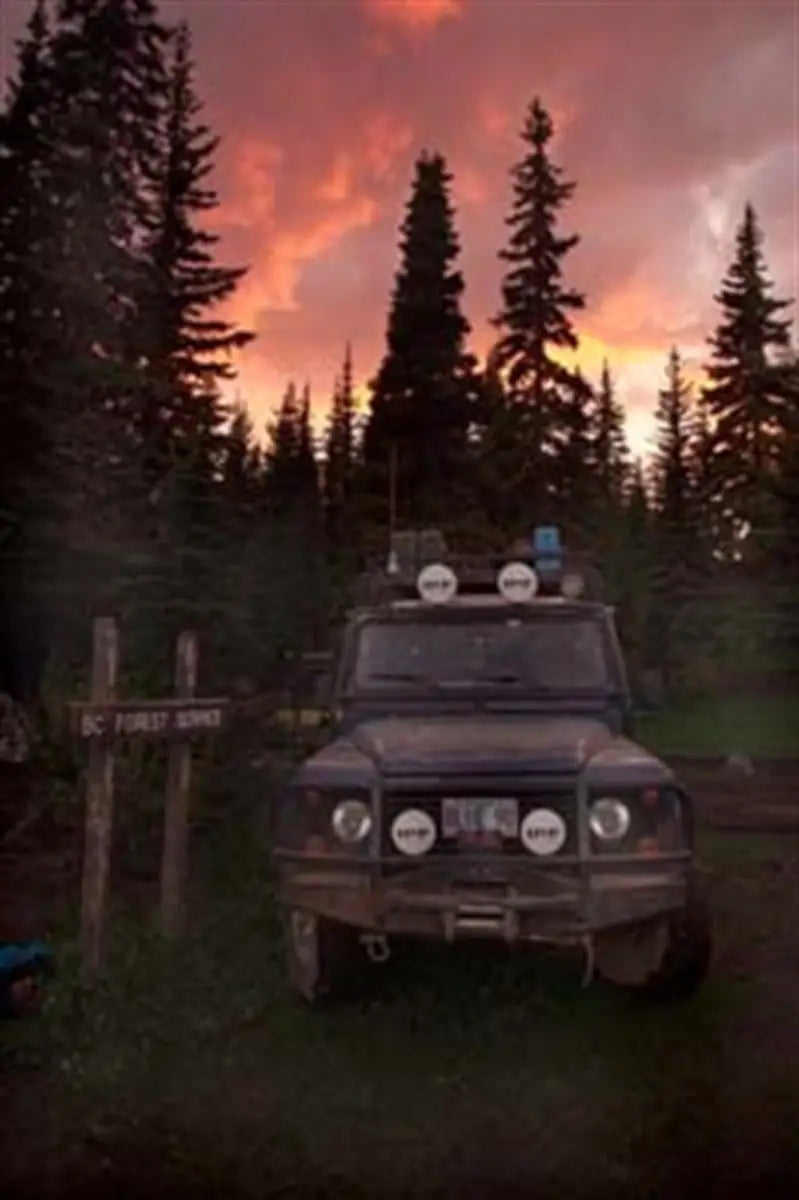 Off-road vehicle with auxiliary lights on Land Rover D90 using ARB Winchbar