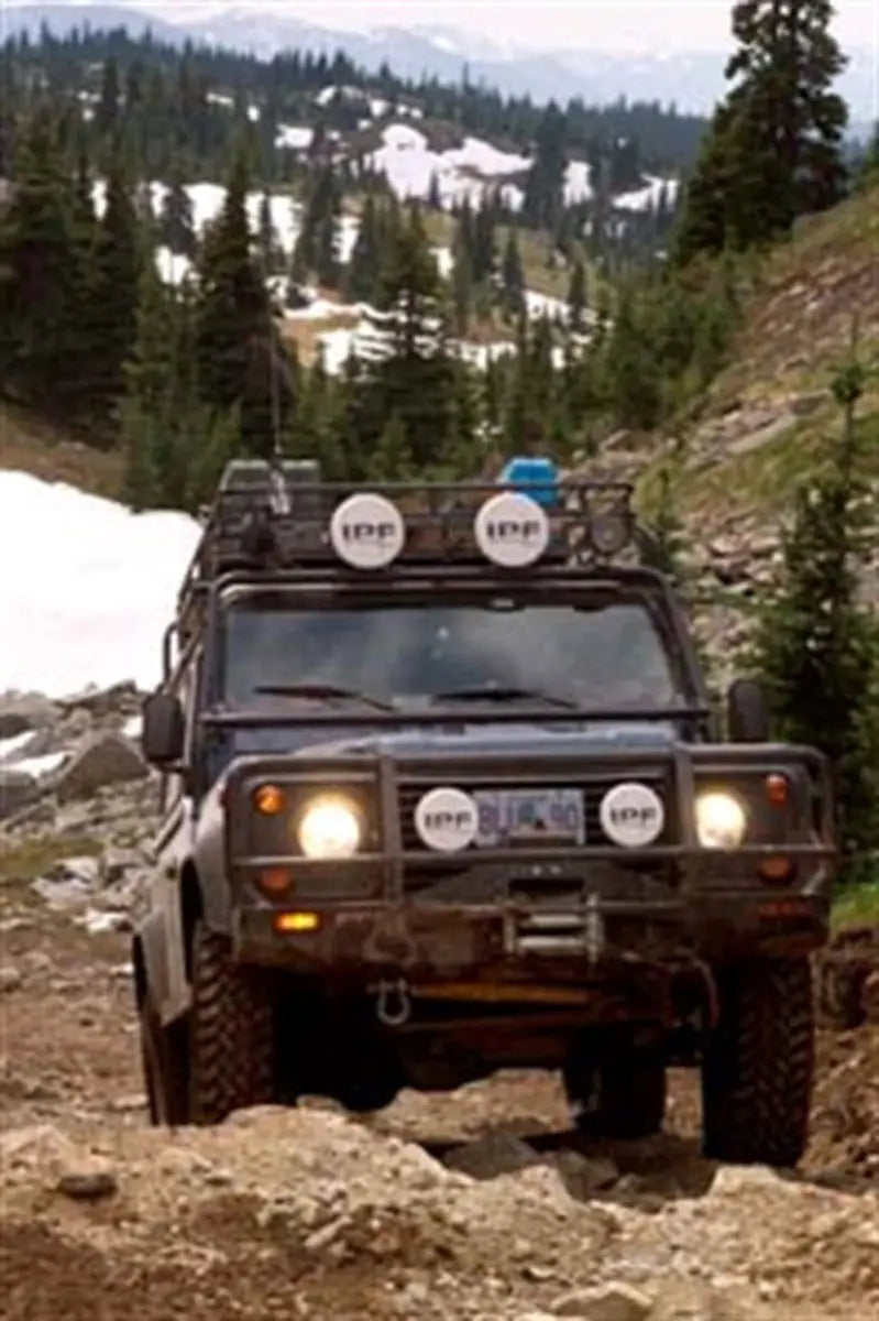 Off-road Land Rover D90 with ARB Winchbar and roof rack for adventures