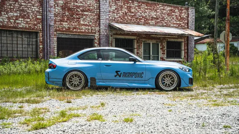Light blue BMW G87 with adjustable lowering springs for a sleek sporty look