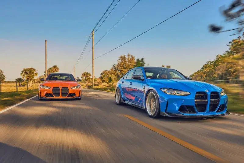 Two modern BMW sedans with AST BMW G87 M2 G80 M3 G82 M4 adjustable lowering springs