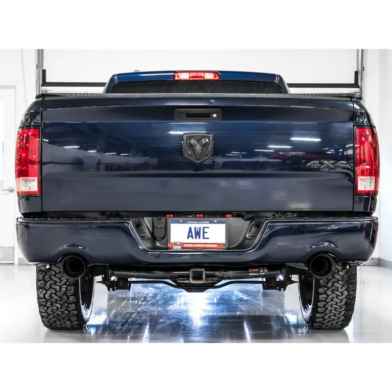 AWE Tuning 3015-33004 AWE Tuning 09-18 RAM 1500 5.7L (w/Cutouts) 0FG Dual Rear Exit Cat-Back Exhaust - Diamond Black Tips