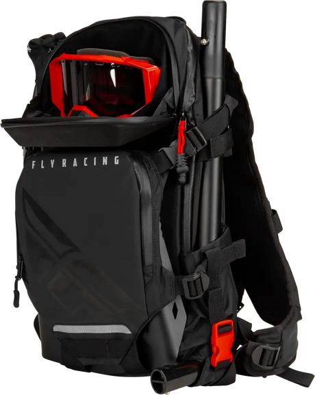 Black Backcountry Pack with shoulder straps, red goggles, and truck parts accessory