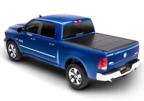 Blue Ram pickup truck with tonneau cover in 8ft bed for Dodge Ram trucks