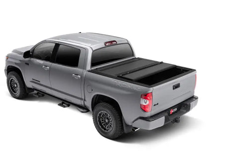 Rear view of a 2022+ Toyota Tundra with a BAKFlip MX4 Bed Cover installed, featuring a sleek, low-profile matte finish and heavy-duty aluminum panels for superior UV and scratch resistance.