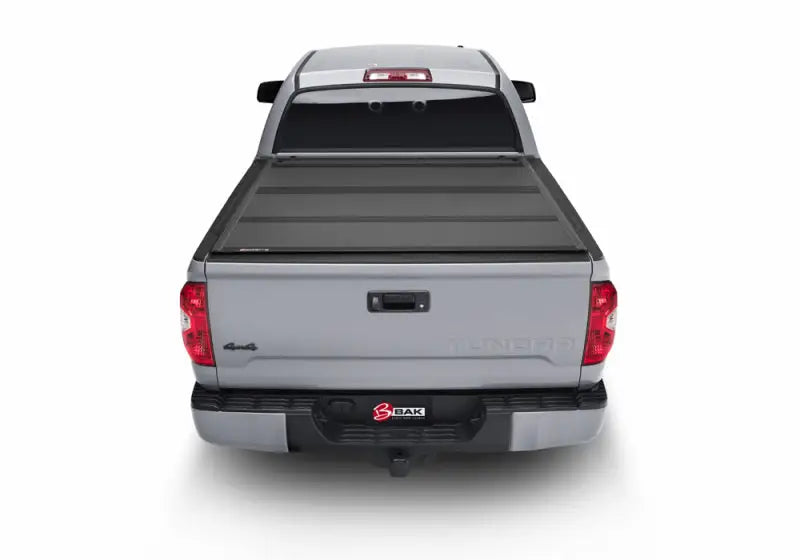 BAK 2022+ Toyota Tundra 5.5ft Bed BAKFlip MX4 Bed Cover installed on a silver truck.